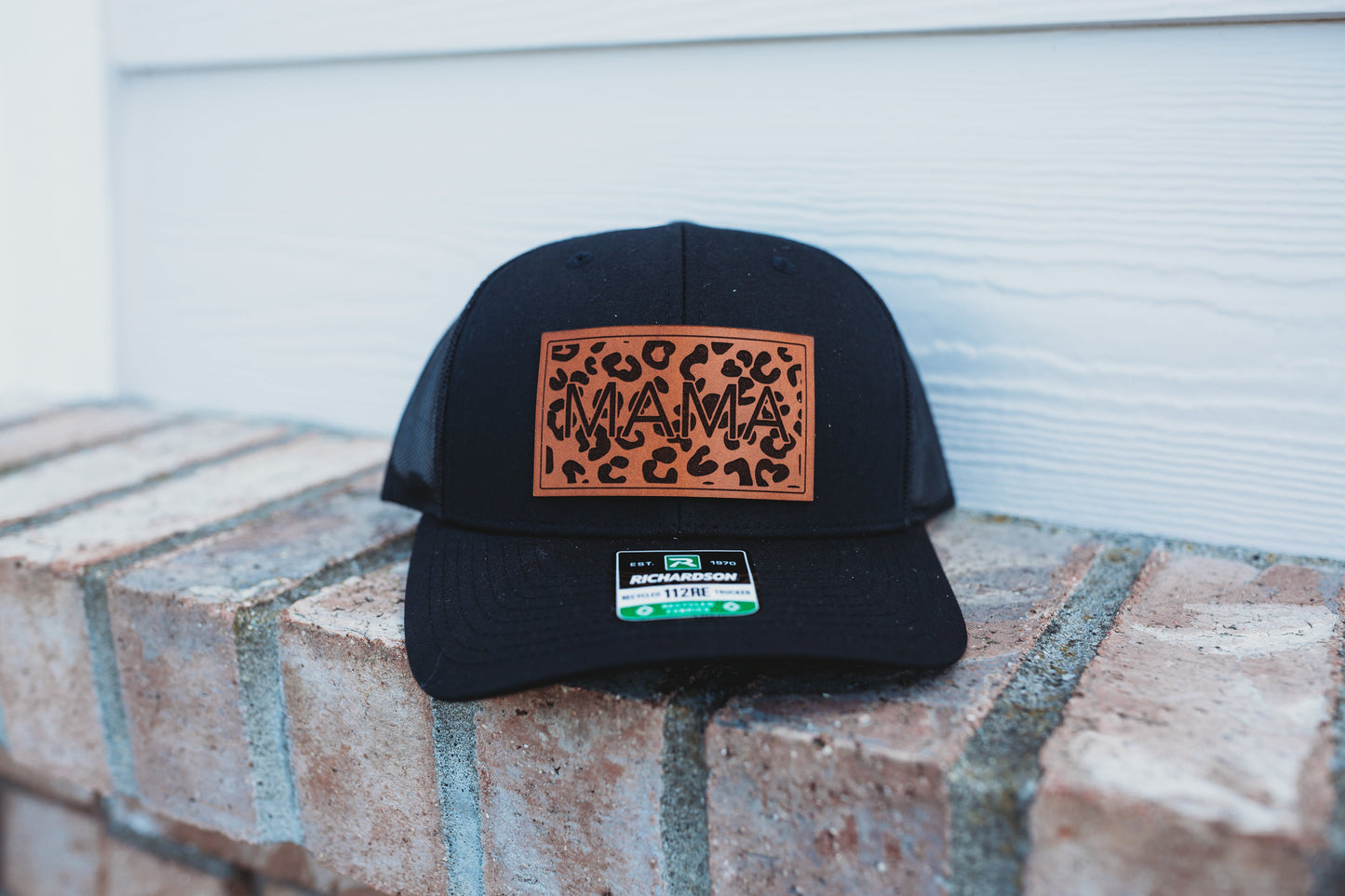 Leopard Mama Custom Leather Patch Hat - Crafthouse Hats leather patch hat company. Custom leather patch hats, also available in bulk or wholesale. Custom leather logo hats, custom leather hats, custom patch hats, leather logo hats, custom leather patches, custom logo leather hats, Richardson leather patch hats, Richardson 112 camo hats, yupoong camo trucker hats, leather hat patches, custom camo hats, leather hat, leather patch for hats, legacy hats, custom party hats, personalized camo hats, custom leather
