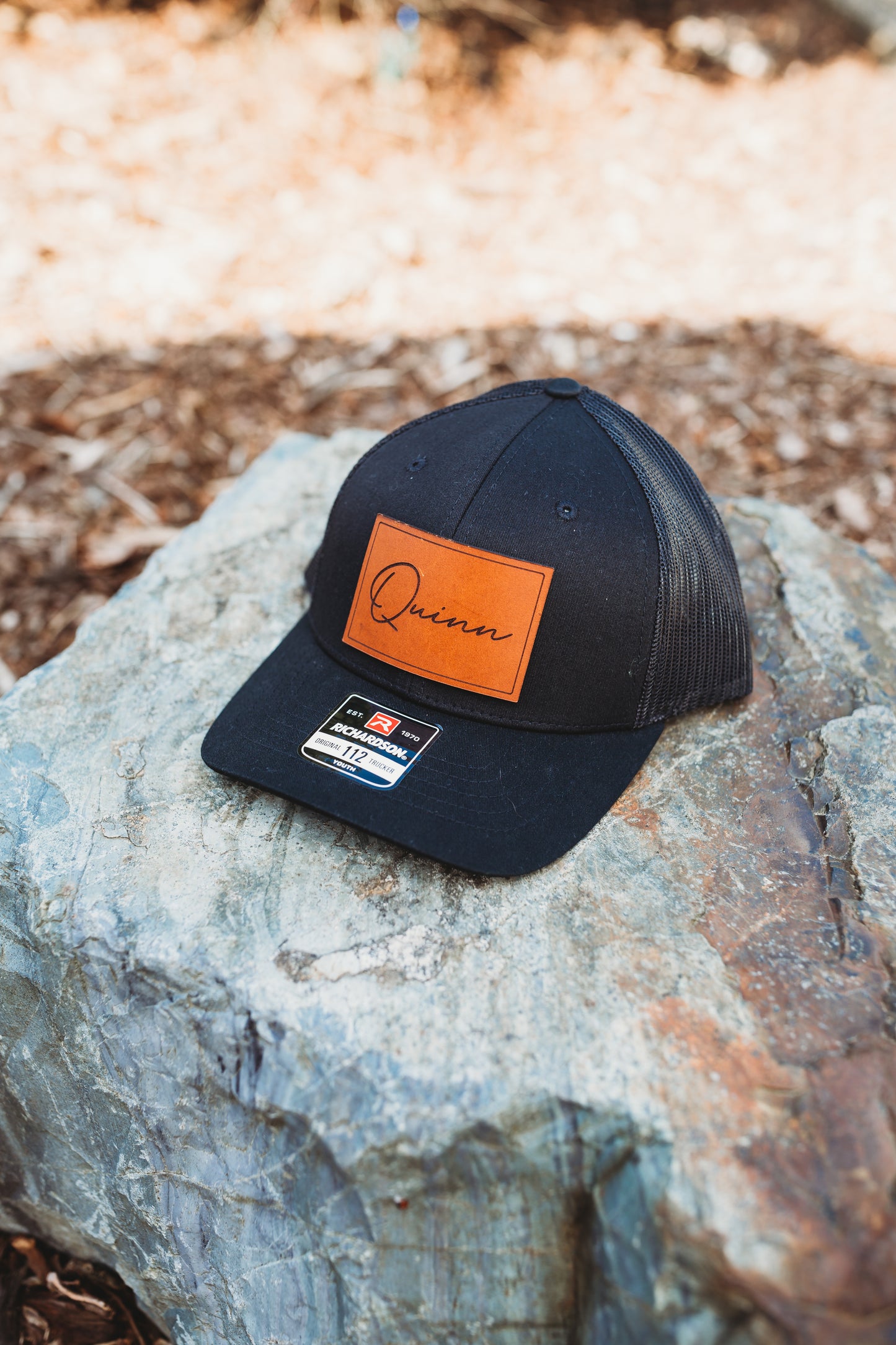 Custom Name Leather Patch Hat - Crafthouse Hats leather patch hat company. Custom leather patch hats, also available in bulk or wholesale. Custom leather logo hats, custom leather hats, custom patch hats, leather logo hats, custom leather patches, custom logo leather hats, Richardson leather patch hats, Richardson 112 camo hats, yupoong camo trucker hats, leather hat patches, custom camo hats, leather hat, leather patch for hats, legacy hats, custom party hats, personalized camo hats, custom leather patches