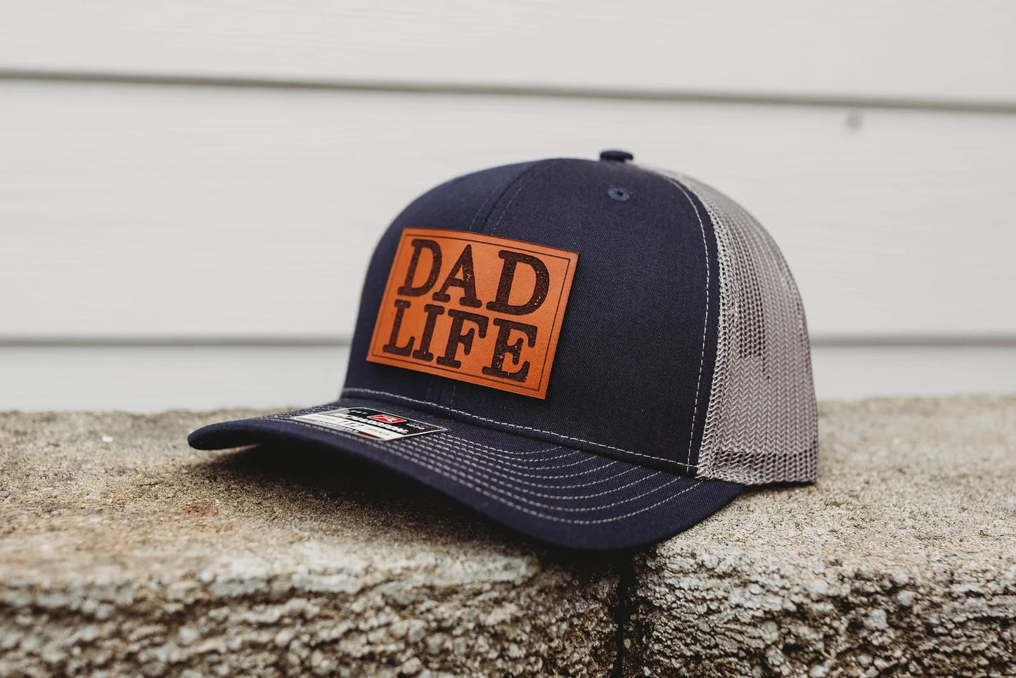 Dad Life Custom Leather Patch Hat - Crafthouse Hats leather patch hat company. Custom leather patch hats, also available in bulk or wholesale. Custom leather logo hats, custom leather hats, custom patch hats, leather logo hats, custom leather patches, custom logo leather hats, Richardson leather patch hats, Richardson 112 camo hats, yupoong camo trucker hats, leather hat patches, custom camo hats, leather hat, leather patch for hats, legacy hats, custom party hats, personalized camo hats, custom leather pat