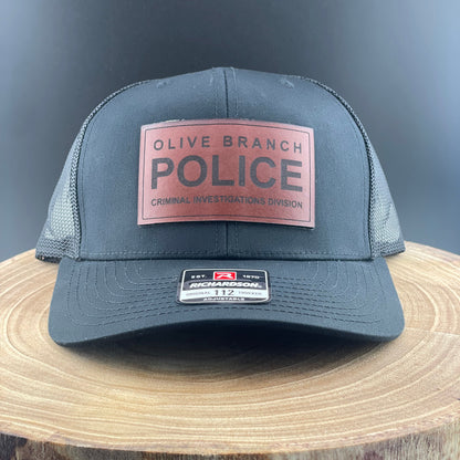 Olive Branch Police Investigations - Crafthouse Hats leather patch hat company. Custom leather patch hats, also available in bulk or wholesale. Custom leather logo hats, custom leather hats, custom patch hats, leather logo hats, custom leather patches, custom logo leather hats, Richardson leather patch hats, Richardson 112 camo hats, yupoong camo trucker hats, leather hat patches, custom camo hats, leather hat, leather patch for hats, legacy hats, custom party hats, personalized camo hats, custom leather pa