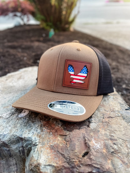 American Eagle Hat - Crafthouse Hats leather patch hat company. Custom leather patch hats, also available in bulk or wholesale. Custom leather logo hats, custom leather hats, custom patch hats, leather logo hats, custom leather patches, custom logo leather hats, Richardson leather patch hats, Richardson 112 camo hats, yupoong camo trucker hats, leather hat patches, custom camo hats, leather hat, leather patch for hats, legacy hats, custom party hats, personalized camo hats, custom leather patches, embroider